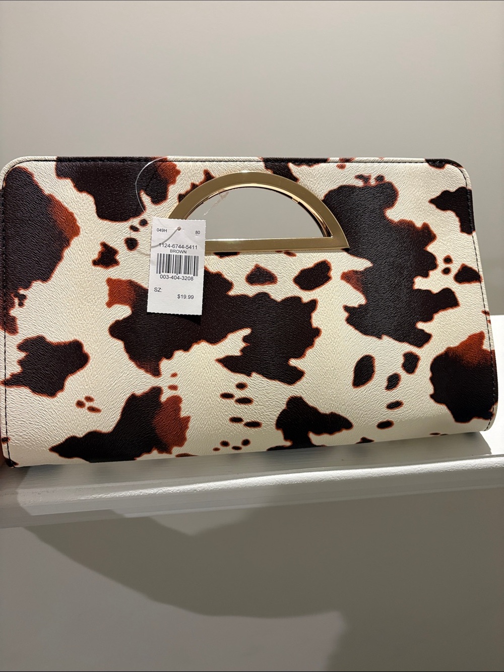 Cowhide Print Cutout Handle Clutch - Brown & White